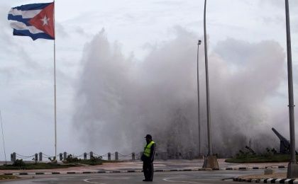 A police officer stands on the seafront boulevard El Malecon ahead of the passing of Hurricane Irma, in Havana, Cuba September 9, 2017.