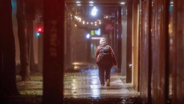 A person walks through downtown Miami as Hurricane Irma nears the city.