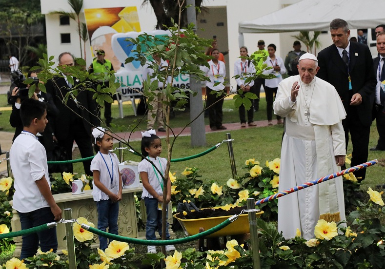 Pope Francis plants a tree during a visit to the cross of the reconciliation at Fundadores park in Villavicencio, Colombia, Sept. 8, 2017.