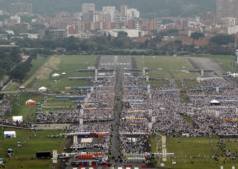 People gather as they wait for Francis to lead mass at the Enrique Olaya Herrera airport in Medellin,Colombia, Sept. 9, 2017.