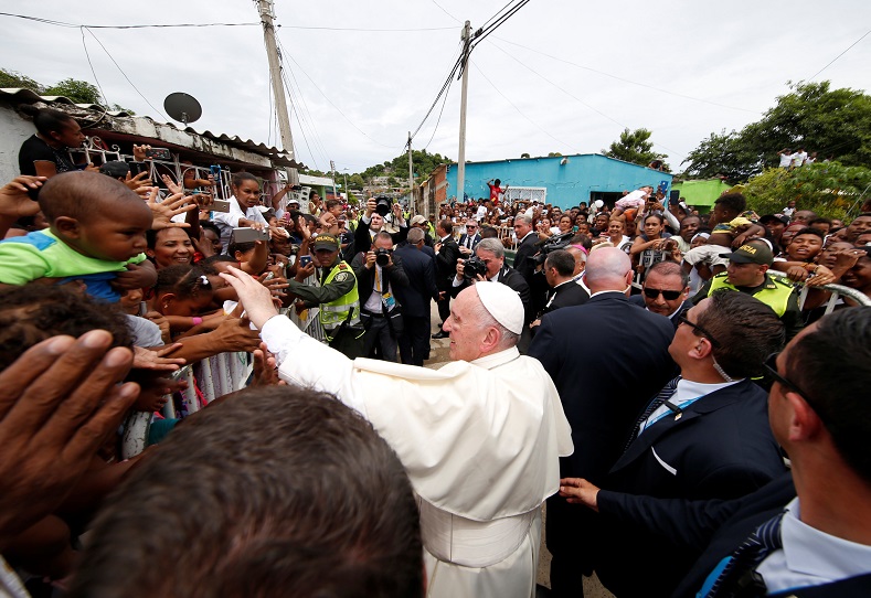 Pope Francis greets people in a neighborhood in Cartagena, Colombia, Sept. 10, 2017.