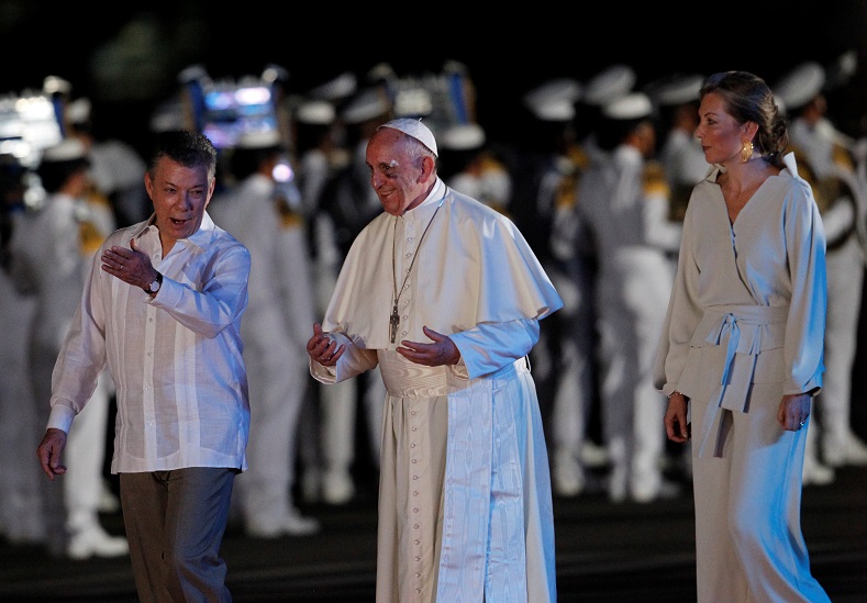 Colombia's President Juan Manuel Santos, Pope Francis and Santos’ wife Maria Clemencia Rodriguez walk together at the airport in Cartagena, Colombia, Sept. 10, 2017.