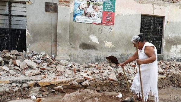 A resident of Juchitán walks through the rubble left by the 8.1-magnitude earthquake.