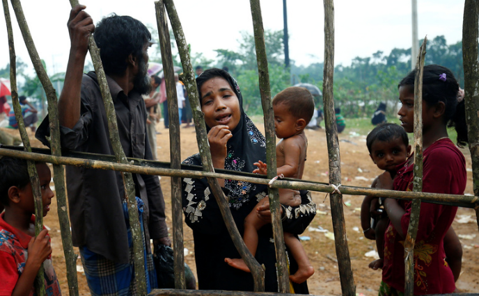 A new Rohingya refugee woman cries as they arrive near the Kutupalang makeshift Refugee Camp, in Cox’s Bazar, Bangladesh, August 30, 2017.