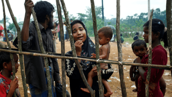 A new Rohingya refugee woman cries as they arrive near the Kutupalang makeshift Refugee Camp, in Cox’s Bazar, Bangladesh, August 30, 2017.