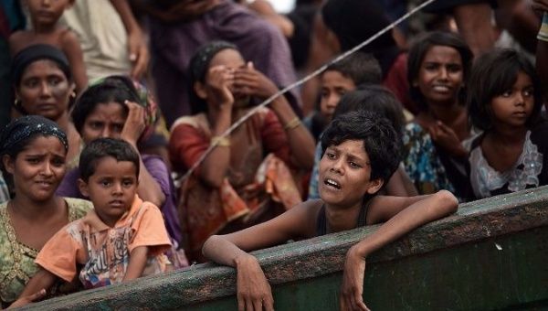 Rohingya Muslims flee violence in Myanmar.
