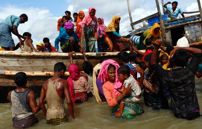 Rohingya refugees arrive after crossing the Bangladesh-Myanmar border through the Bay of Bengal, Bangladesh, September 11, 2017.