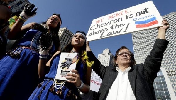 Indigenous activists demand that Chevron pay Ecuador for the environmental damage it has caused throughout the years.