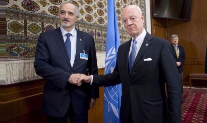 U.N. envoy Staffan de Mistura (R) shakes hands with Syria's Ambassador to the United Nations Bashar al Jaafari (L) during peace talks in Geneva.