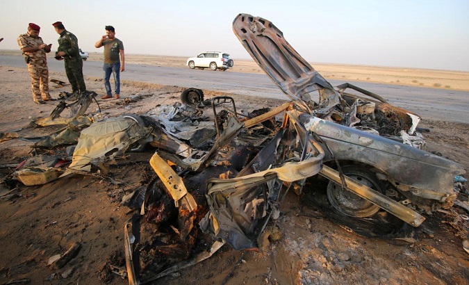 The remains of the vehicle used in a car bomb attack in a terrorist attack that claimed over 80 lives in Iraq.
