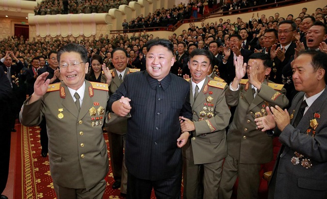 DPRK leader Kim Jong-Un with military officials during a celebration for the engineers who worked on developing a hydrogen bomb in an undated photo.