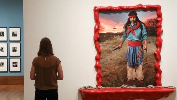 A woman looks at 'Gaucho Gil. Buenos Aires' by the Argentine artist Marcos Lopez at the Getty Museum, Los Angeles, U.S., September 12, 2017 