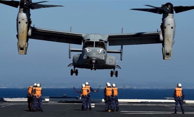 Japanese forces directing a U.S. Marines MV-22 Osprey to land during a joint military exercise in 2015.
