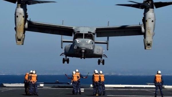 Japanese forces directing a U.S. Marines MV-22 Osprey to land during a joint military exercise in 2015.