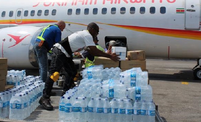 Eight tons of rice, water, milk, sheets, and toiletries was donated by Suriname’s Foreign Affairs Office.