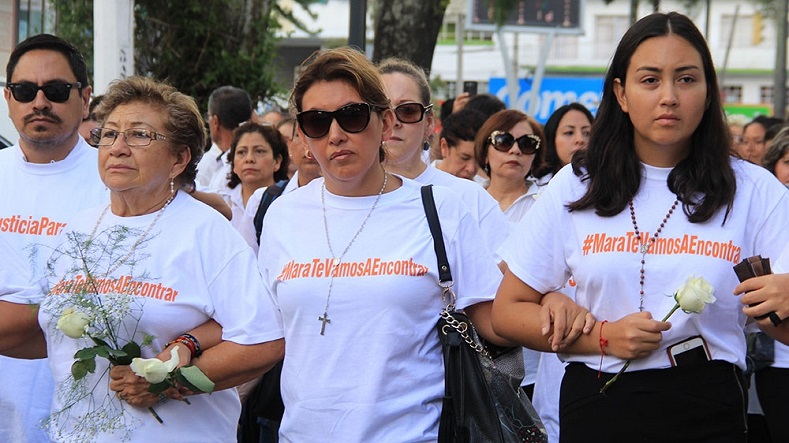 Family members of Mara Fernanda Castilla carry roses and take part in a march in Xalapa, Veracruz state, Mexico.