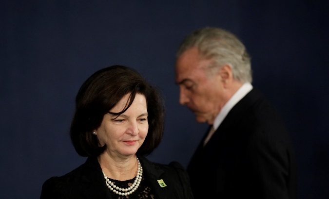 Brazil's President Michel Temer stands behind the new Attorney General Raquel Dodge during her inauguration, in Brasilia, Brazil, September 18, 2017.