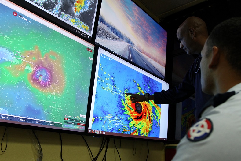 Members of the Emergency Operations Committee monitor the trajectory of Hurricane Maria in Santo Domingo, Dominican Republic.