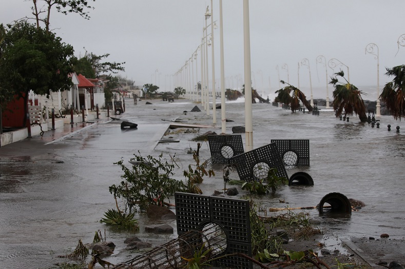 Debris lies on a flooded seafront in Basse-Terre, Guadeloupe.