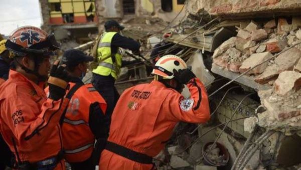 Rescue workers look for survivors still trapped under the rubble in Mexico.