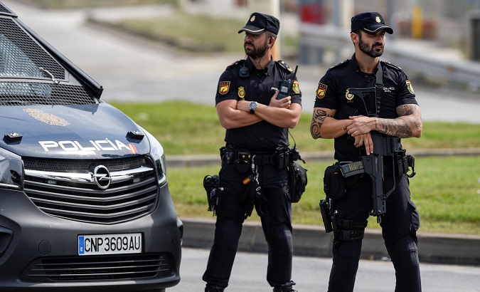 Spanish national police officers stand guard outside a port before the October 1 independence referendum, in Barcelona.