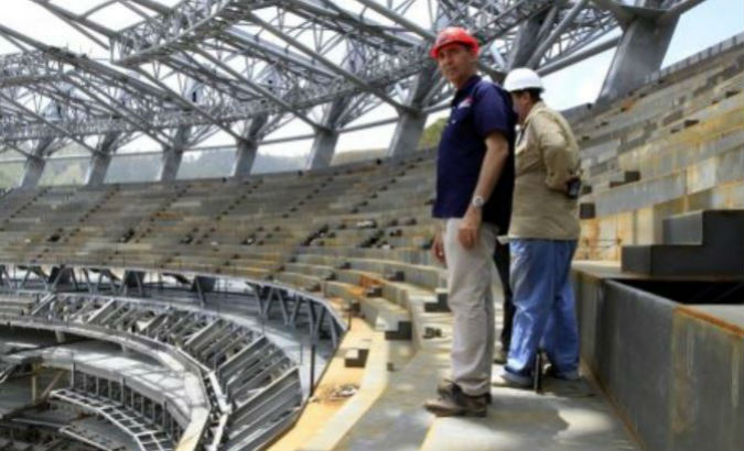 Construction workers inspect the new baseball stadium which will be the largest in South America.