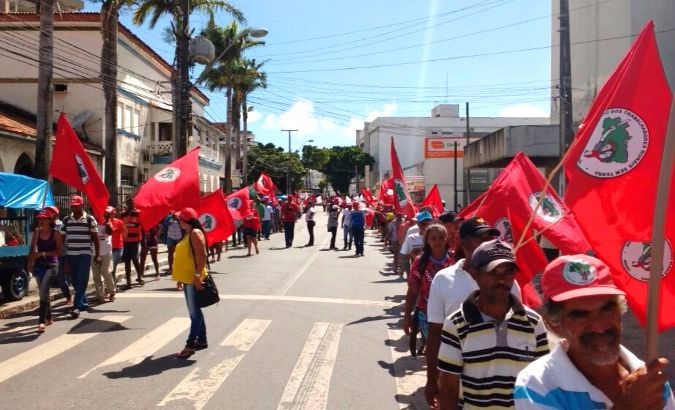 MST members march in the center of Maceio, the capital city of Alagoas state, to protest budget proposal which cuts funding in agrarian reform projects.