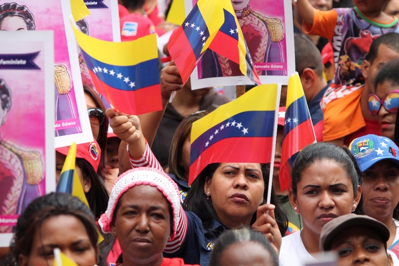 The Venezuelan flag is waved by demonstrators.
