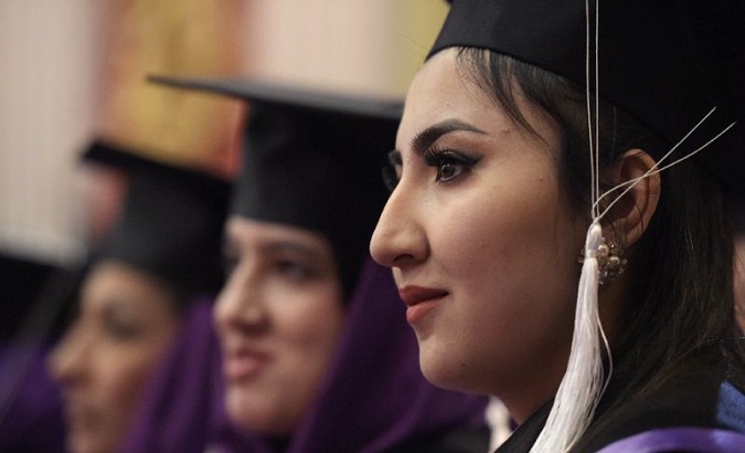 An Afghan female student looks on during the graduation ceremony of the first-ever class of Gender and Women’s studies master's programme in Kabul