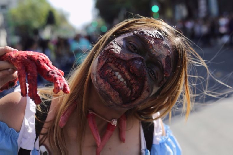 A woman poses at the Zombie Walk in Mexico City.