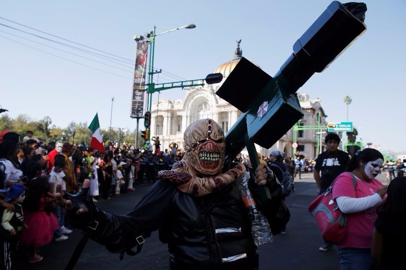 A cross carrying 'walker' at the Zombie Walk in Mexico City.