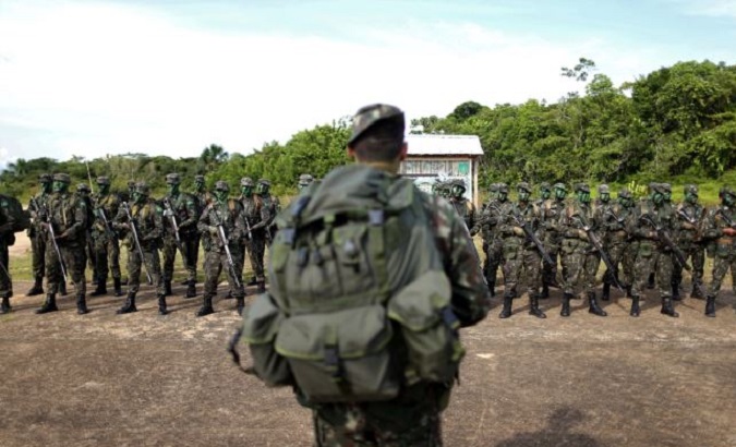 Brazilian Army soldiers at the border with Colombia during a training in Vila Bittencourt, Amazon State, Brazil.