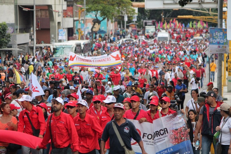 A sea of red-clad Venezuelans celebrate 100 years since the founding of the first socialist state.