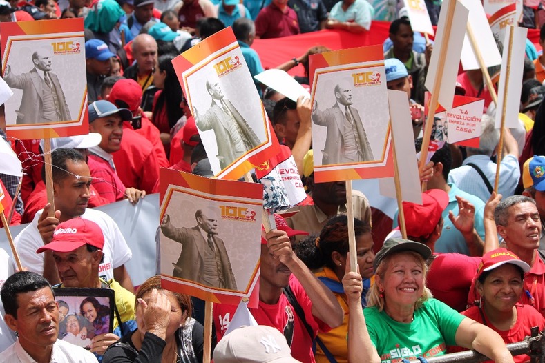 Protesters honor the influence of the Bolshevik revolution on the Bolivarian Revolution in Venezuela.