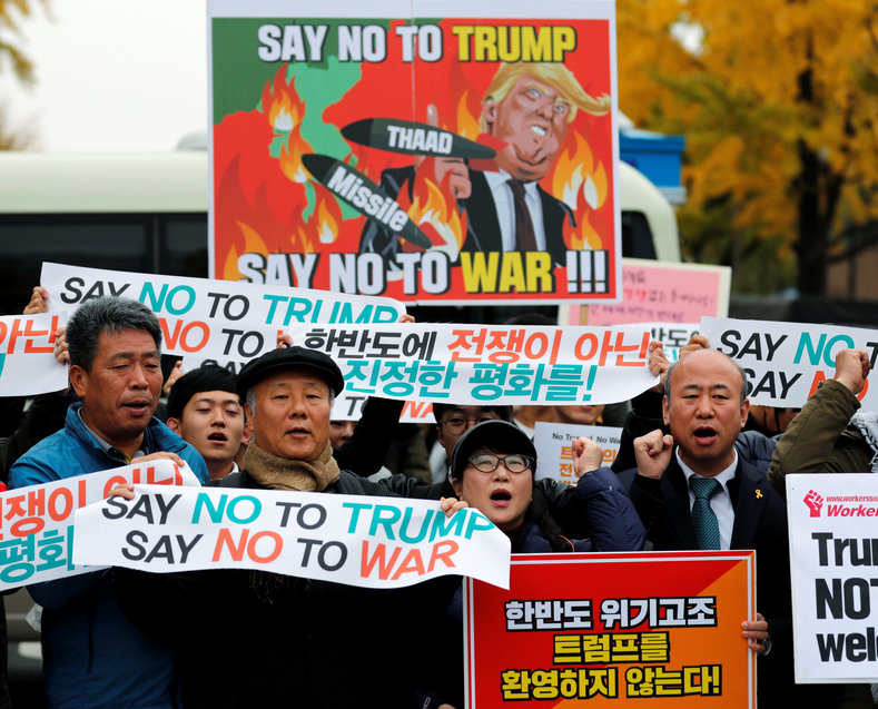 Protesters take part in a rally against U.S. President Donald Trump near South Korea's presidential Blue House in central Seoul, South Korea, Nov. 7, 2017.