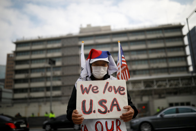 A protester from a far-right civic group stands in front of U.S. embassy in central Seoul, South Korea, Nov. 6, 2017.