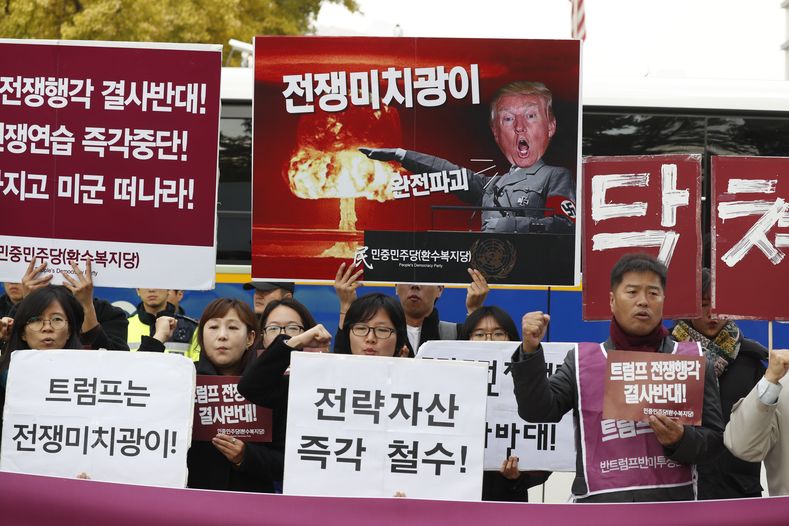 South Korean protesters shout slogans during a rally held to show opposition to the U.S. President's upcoming visit to South Korea, in front of the U.S. embassy in Seoul, South Korea, Nov. 6 2017.