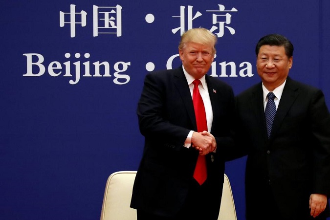 U.S. President Donald Trump and China's President Xi Jinping meet business leaders at the Great Hall of the People in Beijing, China, November 9, 2017.