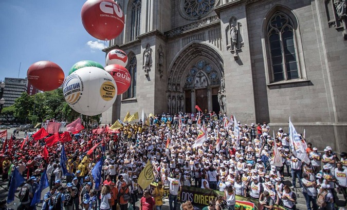 A protest against Temer's proposal to reform Brazil's social security system in front of the Se Cathedral in Sao Paulo.