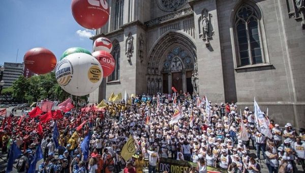 A protest against Temer's proposal to reform Brazil's social security system in front of the Se Cathedral in Sao Paulo.