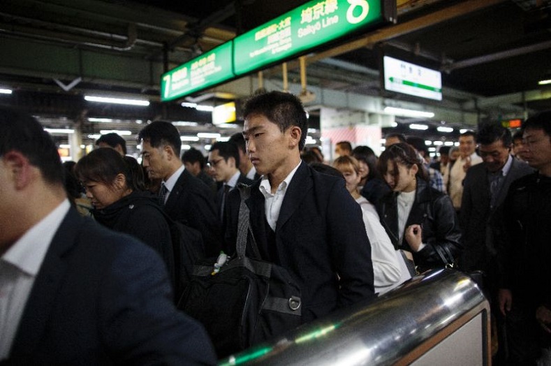 Korean students take the Tokyo subway to get home from school.