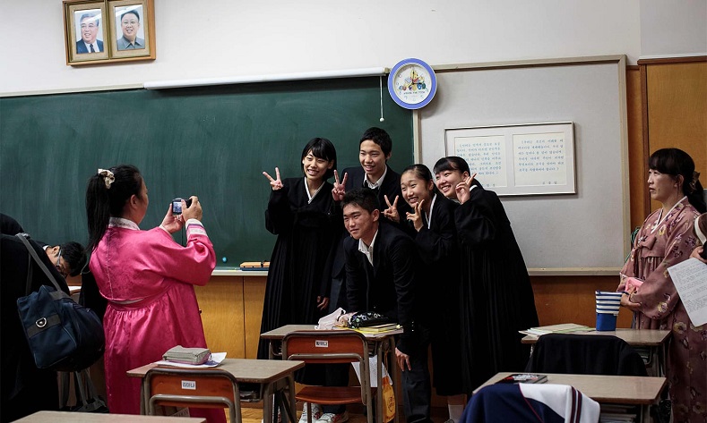 Hwang Song-Wi (centre) takes a picture with his classmates at Tokyo Korean high school.