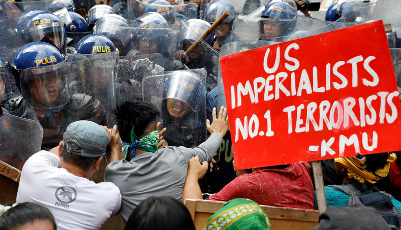 Protesters clash with tactical police officers as they try to march towards the U.S. embassy during a rally against U.S. President Donald Trump's visit, in Manila, Philippines November 10, 2017.