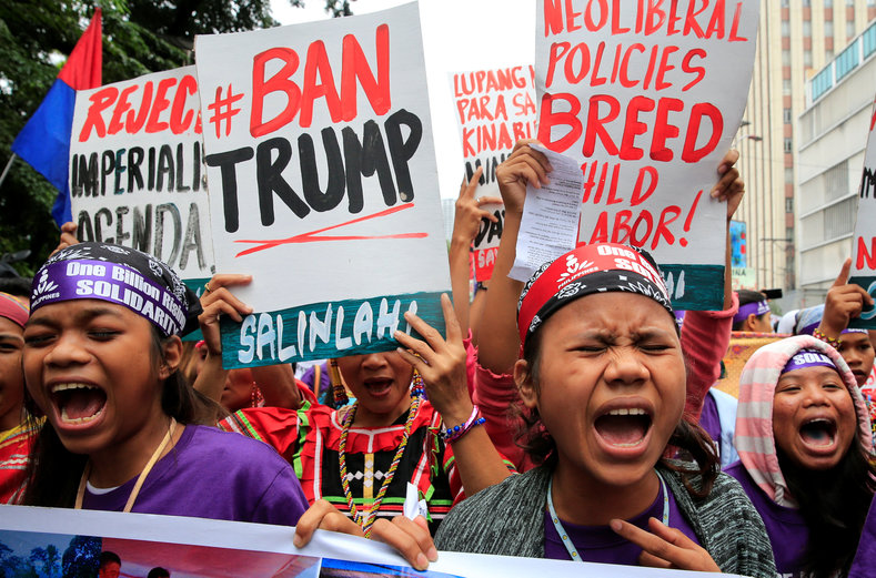 Members of the GABRIELA (Women's Group) shout anti-U.S. government slogans while denouncing the planned visit of U.S. President Donald Trump to attend the 31st Association of Southeast Asian Nations (ASEAN) leaders summit during a protest outside the U.S. embassy in metro Manila, Philippines November 9, 2017.