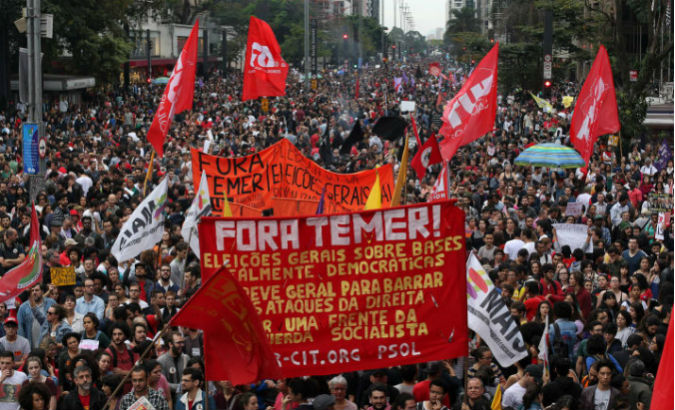 People in Brazil protest against President Michel Temer.