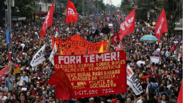 People in Brazil protest against President Michel Temer.