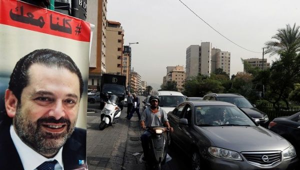 Cars pass next to a poster depicting Saad al-Hariri, who has resigned as Lebanon's prime minister, in Beirut, Lebanon,, Lebanon, November 13, 2017