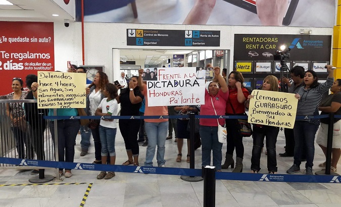 Supporters of Los Guaraguao protest in support of their entry at San Pedro Sula's international airport.