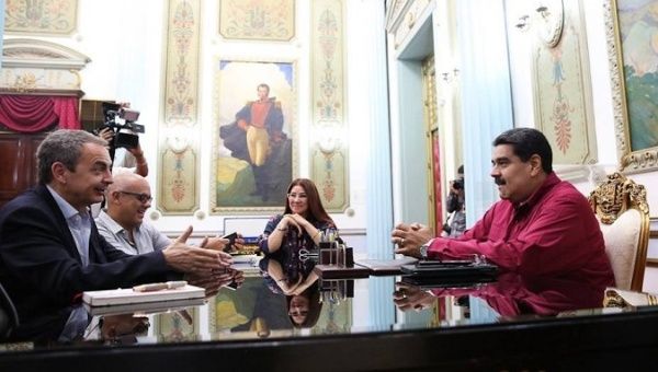 President Nicolas Maduro meets with former Spanish President Jose Luis Rodriguez Zapatero in Caracas.