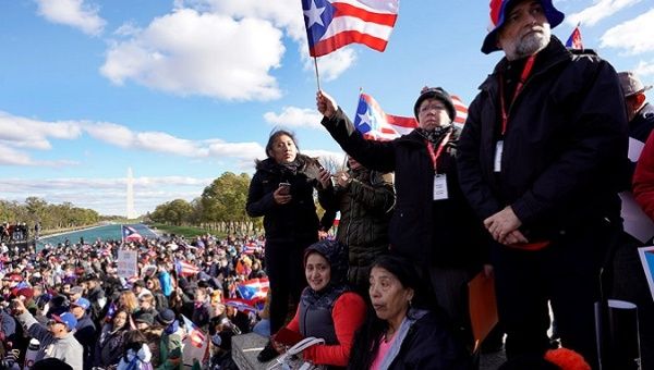 Puerto Ricans gather at the National Mall near the Washington Monument, Nov. 19, 2017.
